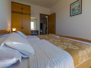 Postel nebo postele na pokoji v ubytování Apartments STIPE