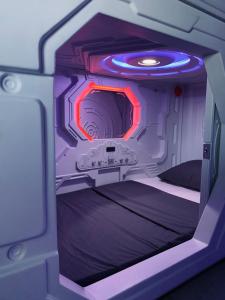 a room in an airplane with a bed in it at Capsule Inn Bali in Legian