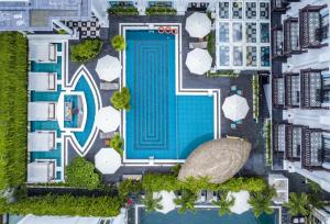 an overhead view of a swimming pool in a city at Anio Boutique Hotel Hoian in Hoi An