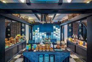 a room with a table with food on it at Anio Boutique Hotel Hoian in Hoi An +86 photos