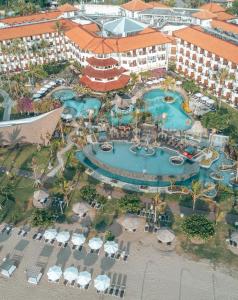 an aerial view of a pool at a resort at Grand Mirage Resort & Thalasso Bali - All Inclusive in Nusa Dua