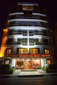 a tall building with a saranatown shift hotel at Sarajevo Suit Hotel in Kocaeli