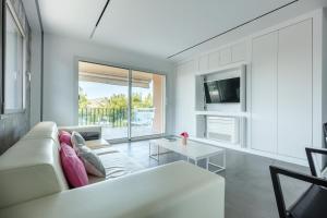 a living room with a couch and a table at Sea Lovers Apartment in Alcudia
