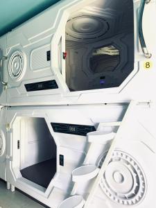a view of the inside of an rv with its door open at Capsule Inn Bali in Legian +41 photos