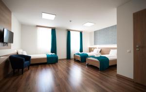 Posteľ alebo postele v izbe v ubytovaní Hotel Szeghalom