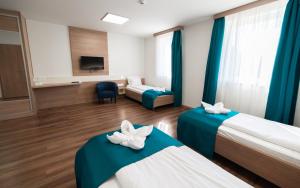 Posteľ alebo postele v izbe v ubytovaní Hotel Szeghalom