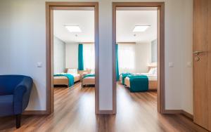 Posteľ alebo postele v izbe v ubytovaní Hotel Szeghalom