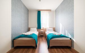 Posteľ alebo postele v izbe v ubytovaní Hotel Szeghalom