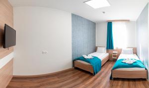 Posteľ alebo postele v izbe v ubytovaní Hotel Szeghalom