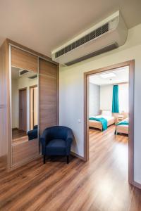 Posteľ alebo postele v izbe v ubytovaní Hotel Szeghalom