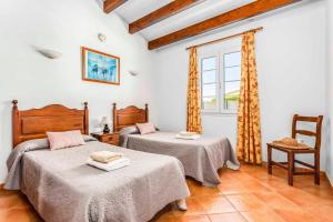 A bed or beds in a room at Villa Fuegosol Még 37 kép