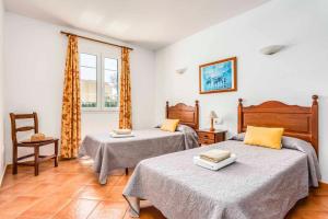 A bed or beds in a room at Villa Fuegosol