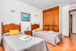 A bed or beds in a room at Villa Fuegosol