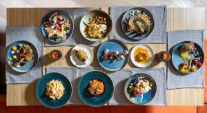 a bunch of plates of food on a table at Labirint Boutique Hotel - Central Location in Bucharest