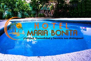a sign on the side of a hotel marina bontina swimming pool at Hotel Maria Bonita Acapulco in Acapulco