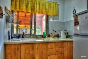 a kitchen with a sink and a window at Country lodging in Manot in Manot