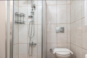 a bathroom with a shower with a toilet at Dualis Hotel in Istanbul