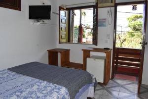 Postel nebo postele na pokoji v ubytování Pousada Pico das Praias