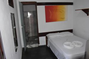 Letto o letti in una camera di Pico das Praias Suites