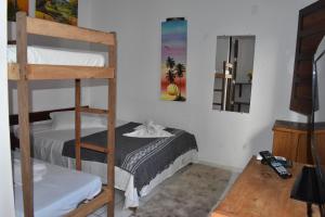 Postel nebo postele na pokoji v ubytování Pousada Pico das Praias