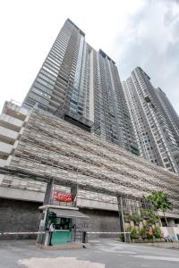 a tall building with a store in front of it at Rex Ollie @ The Elements Ampang in Kuala Lumpur
