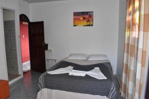 Postel nebo postele na pokoji v ubytování Pousada Pico das Praias