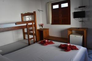 Postel nebo postele na pokoji v ubytování Pousada Pico das Praias