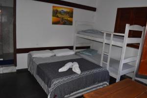 Postel nebo postele na pokoji v ubytování Pousada Pico das Praias