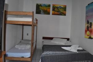 Postel nebo postele na pokoji v ubytování Pousada Pico das Praias