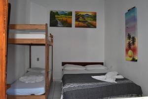 Postel nebo postele na pokoji v ubytování Pousada Pico das Praias