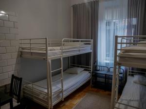 Ένα ή περισσότερα κρεβάτια σε δωμάτιο στο Cent Hostel