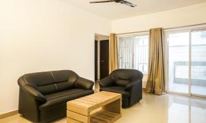 Posezení v ubytování Treebo Luxe Suite, Shivaji Nagar