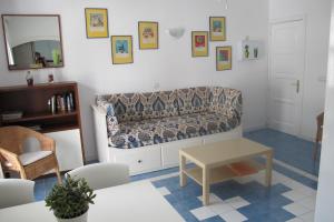 a living room with a couch and a table at HarbourPlaya de Mogan in Puerto de Mogán