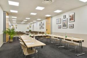 a conference room with tables and chairs in it at Appart'City Classic Lyon Part-Dieu in Lyon