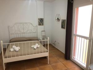 En eller flere senge i et værelse på Center Holiday Corralejo + 12 billeder