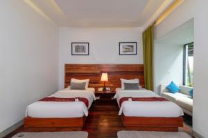 Postel nebo postele na pokoji v ubytování King Rock Boutique Hotel