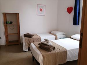 Ein Bett oder Betten in einem Zimmer der Unterkunft La casa di Alice