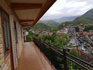 a balcony of a building with a view of a city at Ensol B&B in Peshkopi