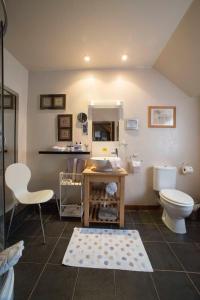a bathroom with a toilet and a sink at Langside Bed and Breakfast in Fenwick
