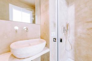 a bathroom with a sink and a shower at Dimora Anderì in Polignano a Mare
