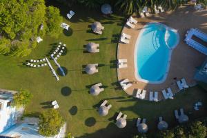an overhead view of a swimming pool and a park at Mandraki Village Boutique Hotel in Koukounaries