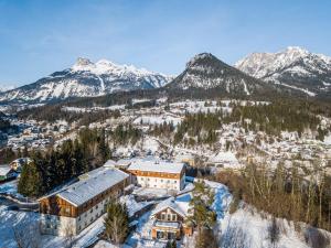 an aerial view of a resort in the snow with mountains at JUFA Hotel Bad Aussee in Bad Aussee
