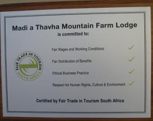 a sign for a mountain farm lodge at Madi a Thavha Mountain Lodge in Louis Trichardt