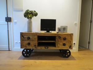 a wooden cart with a computer on top of it at Belém 27, terrace apartment in Lisbon