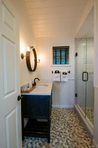 a bathroom with a blue sink and a shower at Dahlonega Resort and Vineyard in Dahlonega