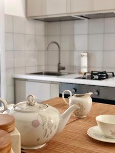 a kitchen with a table with a tea pot and cups at Casino' Porta -Teatro in Sanremo