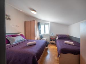 Postel nebo postele na pokoji v ubytování Apartments Zaton