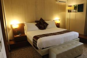 Katil atau katil-katil dalam bilik di Mamba Point Hotel