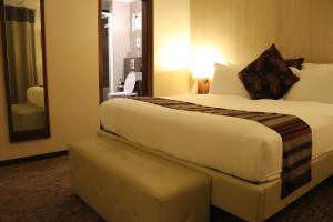 Katil atau katil-katil dalam bilik di Mamba Point Hotel