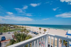a beach scene with a view of the ocean at Seaside Amelia Inn - Amelia Island in Amelia Island